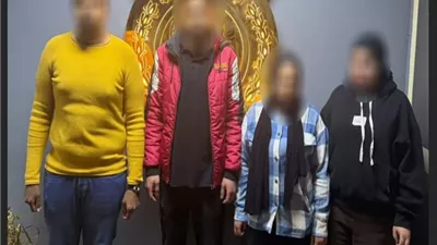 سقوط طرفي مشاجرة فتاتين وفرد أمن بموقف سيارات بالهرم
