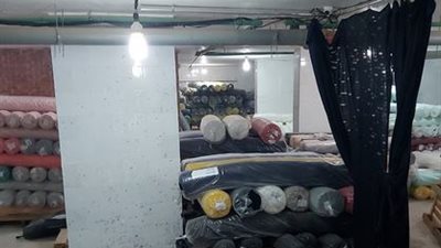 مباحث تموين العاصمة تضبط مخزنا للاقشمة المهربة جمركياً