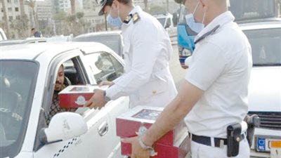 الخدمات الأمنية توزع وجبات إفطار للصائمين علي مستوي الجمهورية