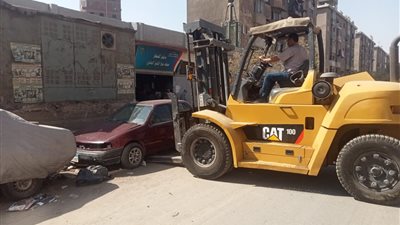 تجريد و تنظيف شارع المطار ورفع السيارات المتهالكة بالمنيرة